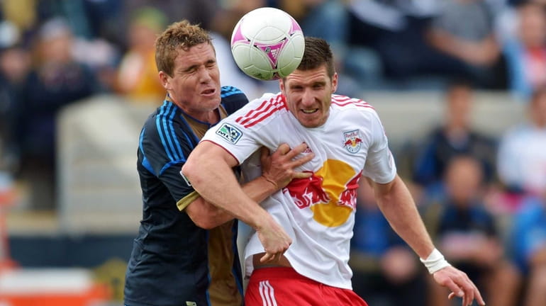 The Union's Chris Albright and the Red Bulls' Kenny Cooper...
