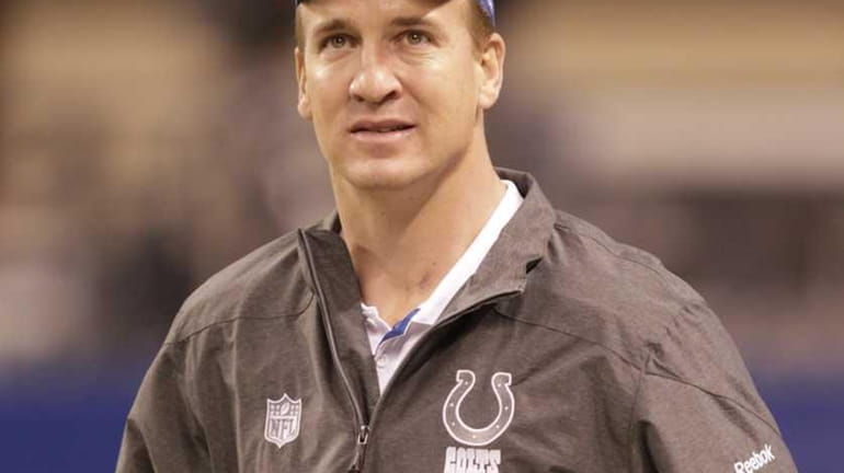 Peyton Manning is seen on the sidelines in Indianapolis before...