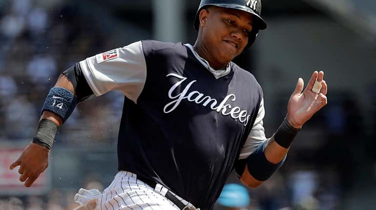 New York Yankees second baseman Starlin Castro rounds third on...