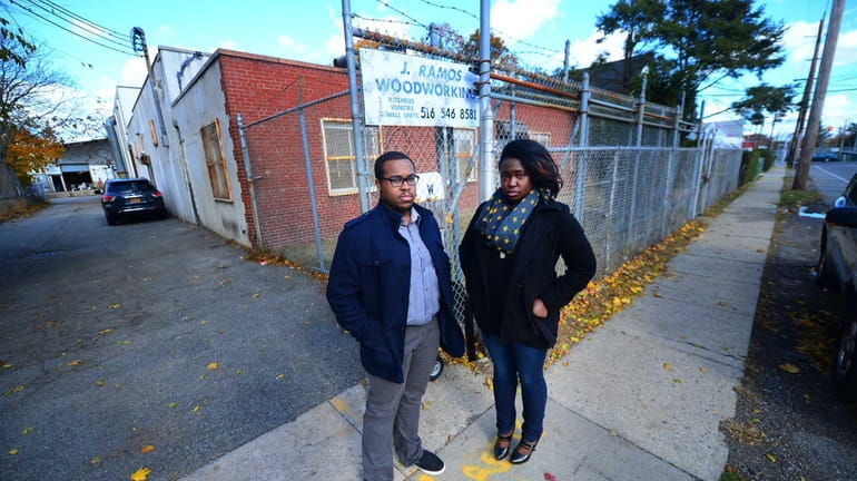 Roosevelt residents Jacob Dixon and Sharisse Carter stand in front...
