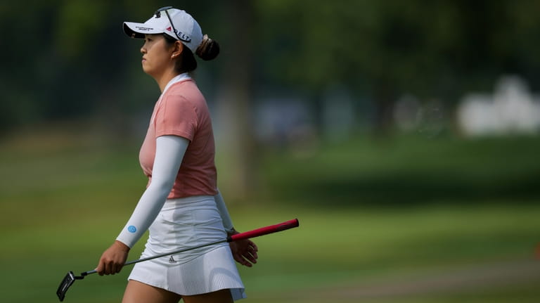 Rose Zhang walks to the fifth green during the first...
