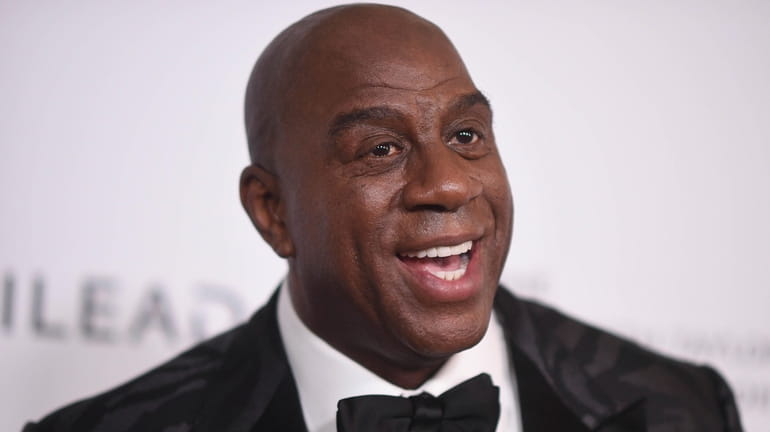 Magic Johnson attends the Elizabeth Taylor Ball to End AIDS...