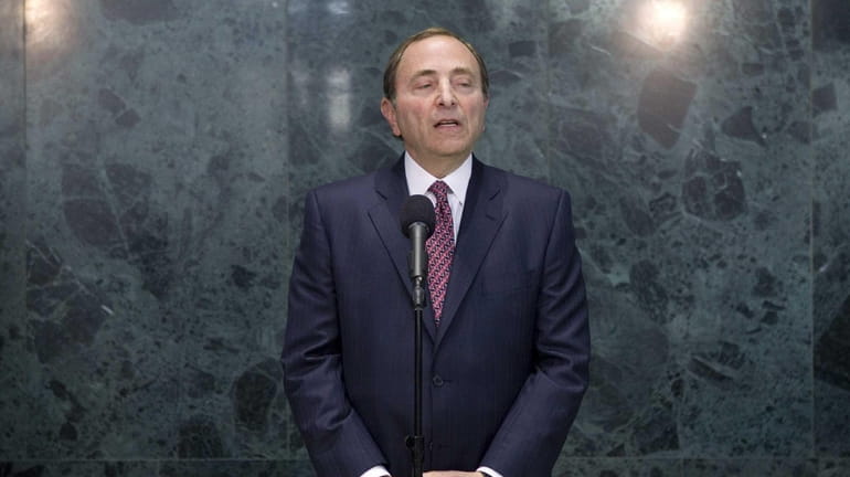 NHL commissioner Gary Bettman speaks to reporters following collective bargaining...