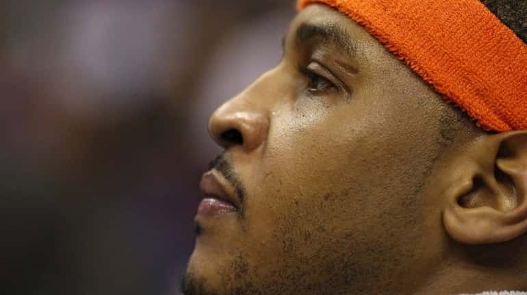 Carmelo Anthony of the New York Knicks looks on against...