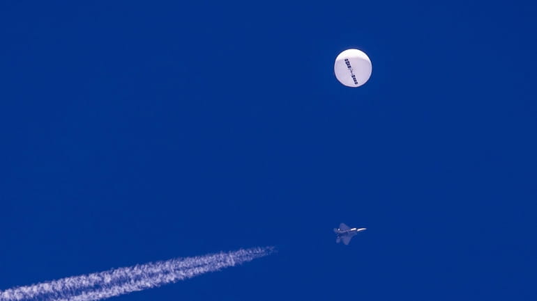 A large balloon drifts above the Atlantic Ocean, just off...
