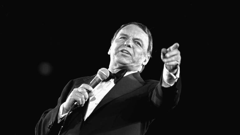 Frank Sinatra performs at the Nassau Veterans Memorial Coliseum in...