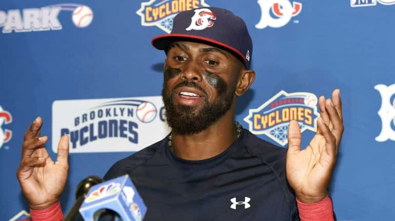 New York Mets' Jose Reyes answers questions from the media...