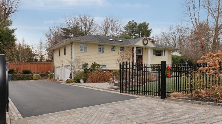 This four-bedroom Glen Cove high-ranch, listed for $948,000 in March...