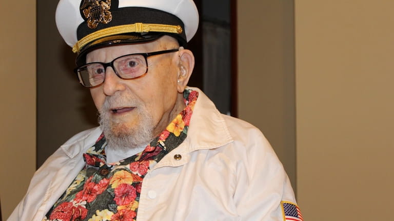 Pearl Harbor survivor Ira "Ike" Schab, 103, wears a U.S....