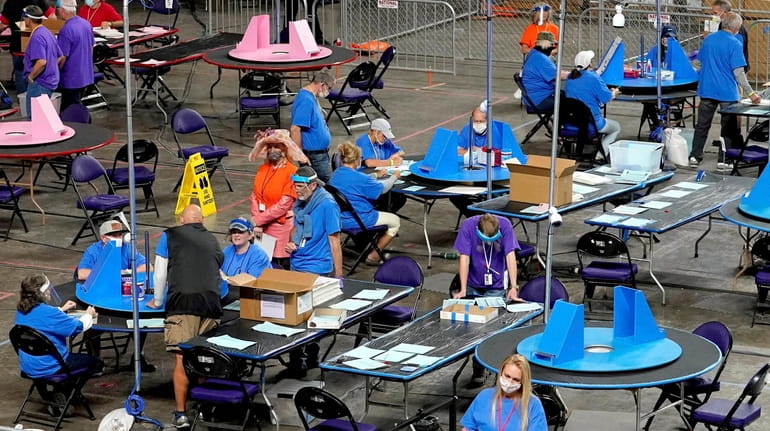 Republican-hired contractors Cyber Ninjas examine and recount 2020 election ballots in...