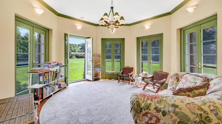 The octagonal family room gives onto the 1.3-acre property.