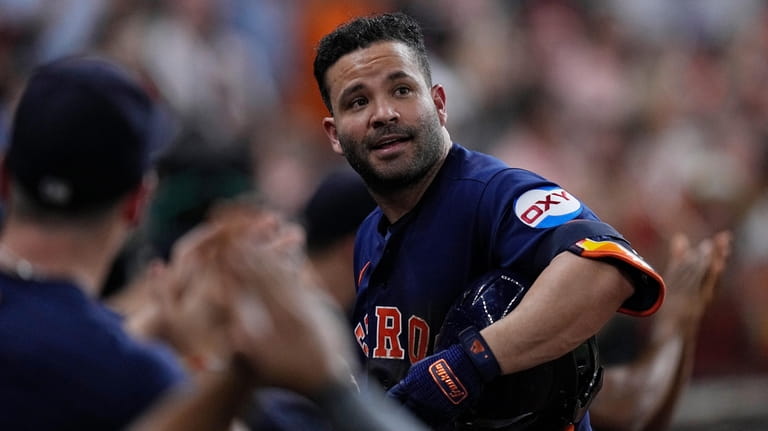 Houston Astros' Jose Altuve takes a curtain call after his...