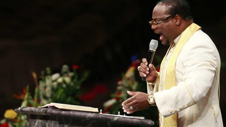 Bishop Eddie Long speaks during a funeral service at New...