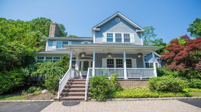 The five-bedroom, 4½-bath Colonial has the potential for an income apartment...