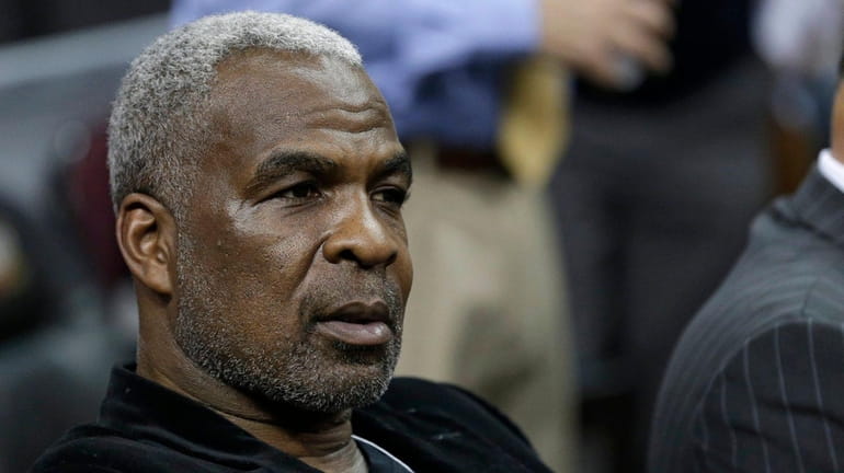 Former Knick Charles Oakley waits for game to begin between...