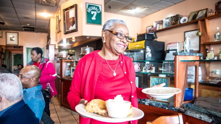 LL Dent restaurant co-owner Lillian Dent serves Southern-style cooking, as...