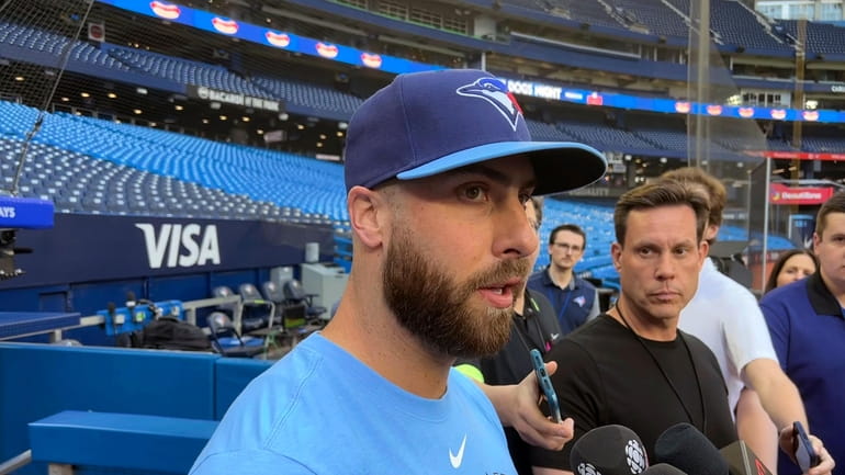 Toronto Blue Jays relief pitcher Anthony Bass speaks to gives...