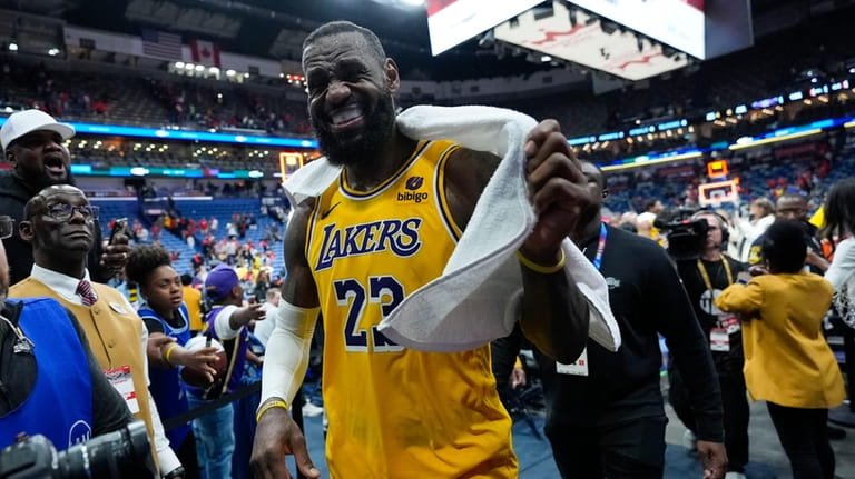 Los Angeles Lakers forward LeBron James (23) smiles as he...