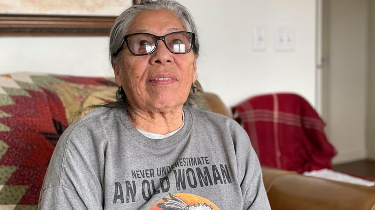 Madonna Thunder Hawk, 83, sits in her home near Rapid...