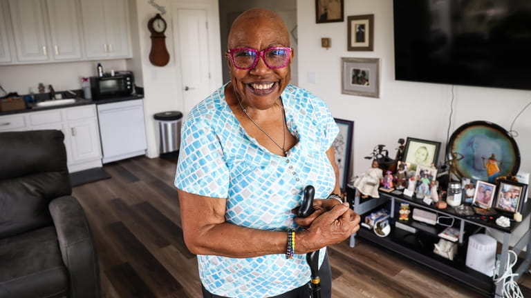 Elaine Felton displays family photos and mementoes from past Gay...