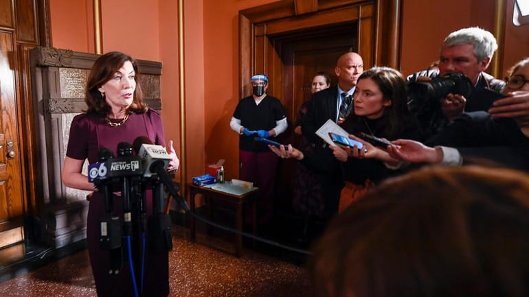 Gov. Kathy Hochul talks with reporters about the budget at the...