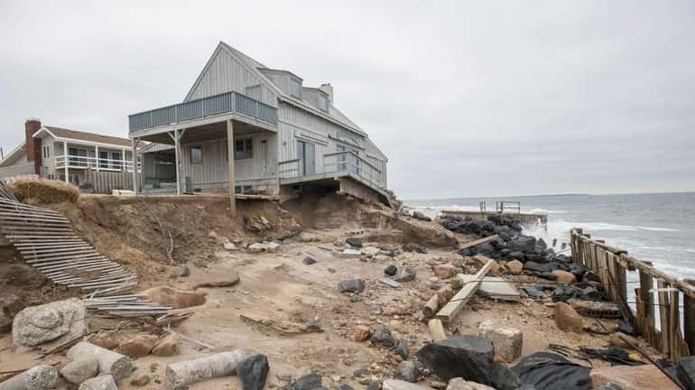 Erosion damage caused by superstorm Sandy at home on Captain...
