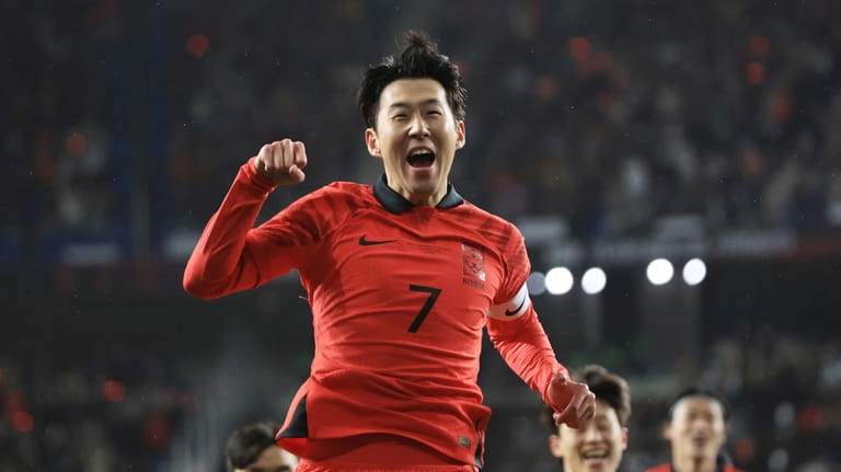 South Korea's Son Heung-min celebrates after scoring his side's opening...
