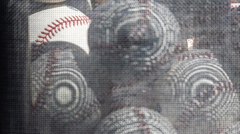 A basket full of baseballs is seen on the main...