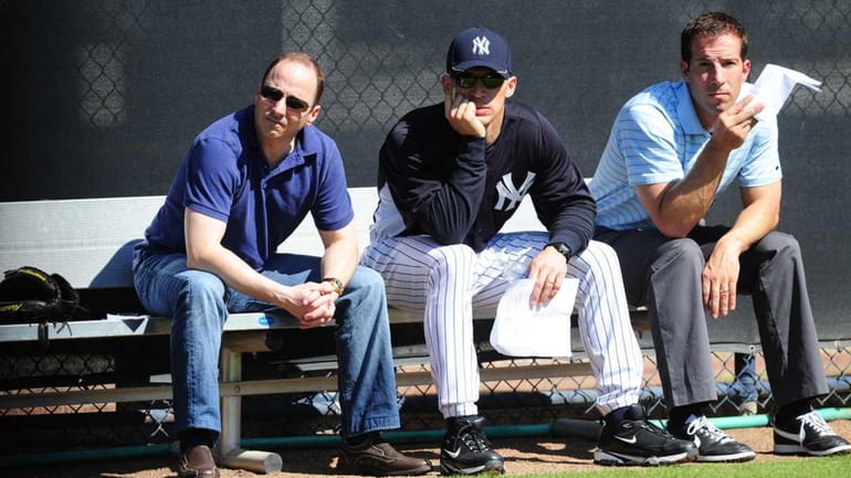 New York Yankees general manager Brian Cashman, manager Joe Girardi,...
