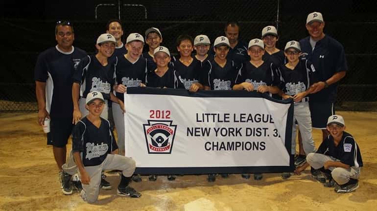 Plainview 12-year-olds hold their championship banner after winning the District...