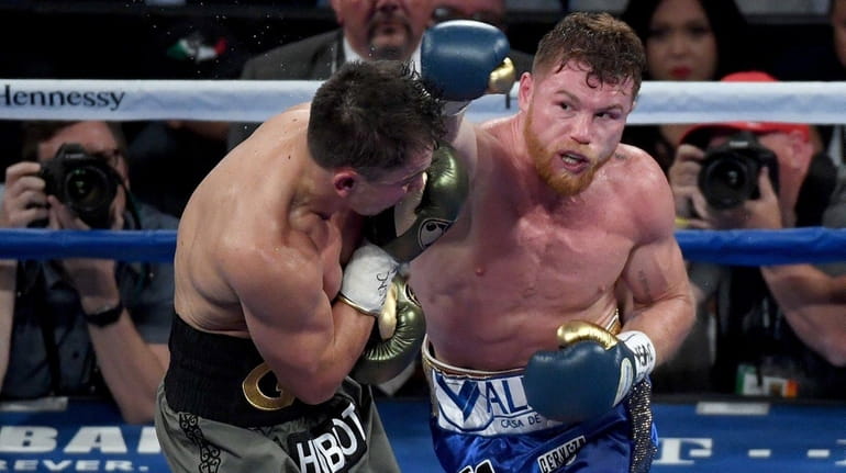 Canelo Alvarez throws a punch at Gennady Golovkin at T-Mobile...