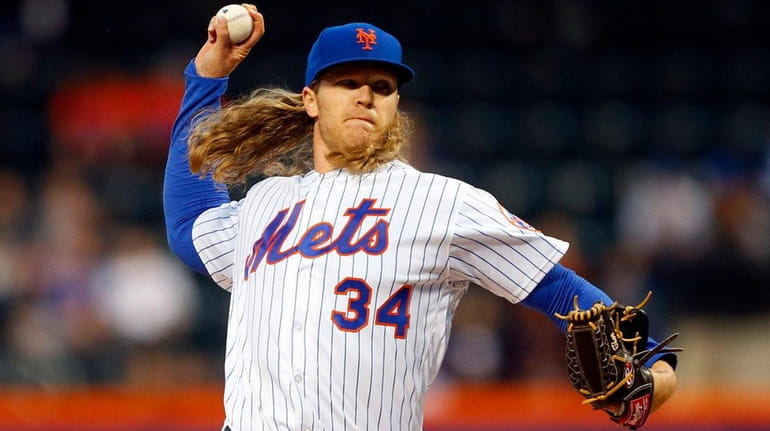 Noah Syndergaard of the Mets pitches in the first inning...