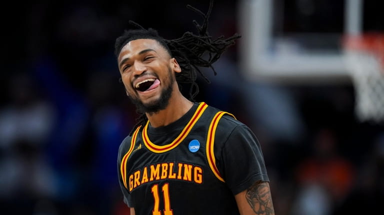 Grambling State guard Jourdan Smith reacts to making a 3-point...