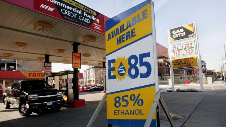A sign advertises the availability of ethanol E85 fuel at...