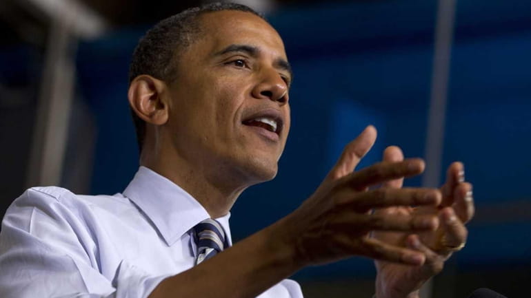 President Barack Obama gestures while speaking at Honeywell in Golden...