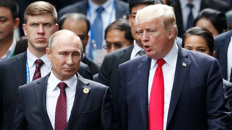 President Donald Trump with Russian President Vladimir Putin during the APEC...