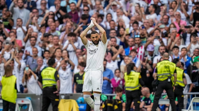 Real Madrid's Karim Benzema claps to supporters during the Spanish...