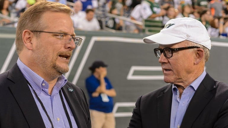 Jets general manager Mike Maccagnan and owner Woody Johnson during...