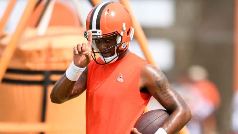 Cleveland Browns quarterback Deshaun Watson gestures to fans during the...