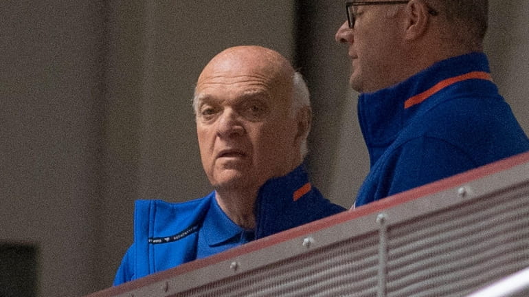 Islanders GM Lou Lamoriello watches his team on the ice during...