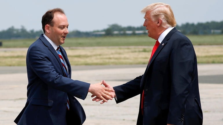 Rep. Lee Zeldin greets then-President Donald Trump at Francis S....