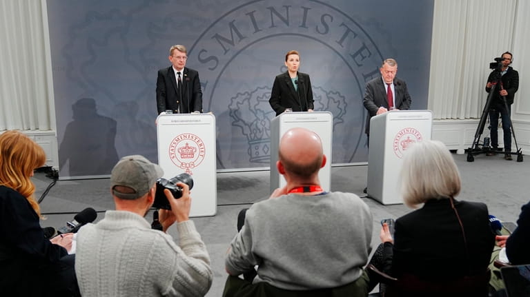Danish Prime Minister Mette Frederiksen, center, Deputy Prime Minister and...