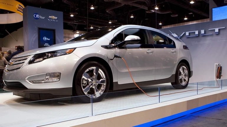 A General Motors Co. Chevrolet Volt electric vehicle sits on...