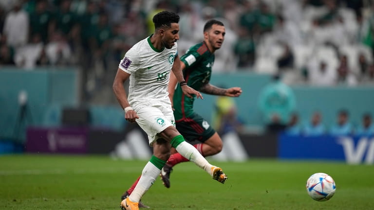 Saudi Arabia's Salem Al-Dawsari scores his side's first goal during...