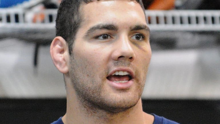 Mixed martial arts fighter Chris Weidman, 26, encourages his students...