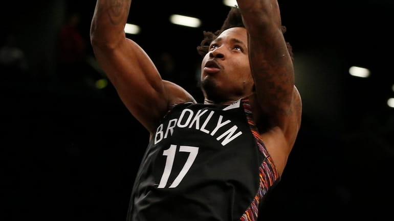Ed Davis of the Nets dunks the ball in the...