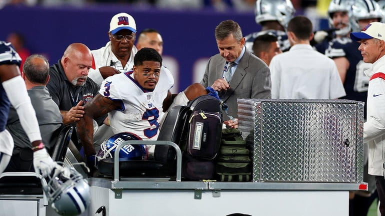 Sterling Shepard #3 of the New York Giants is carted...