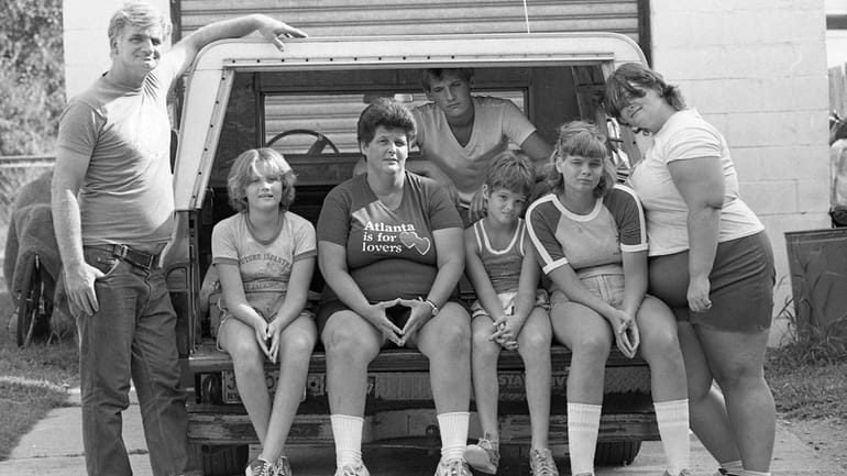 The Koster family on Aug. 22, 1982 with the pickup they...
