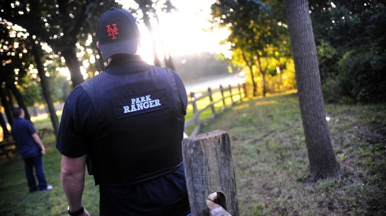 Park Ranger Tom Lohmann patrols a park in Smithtown. Officials...