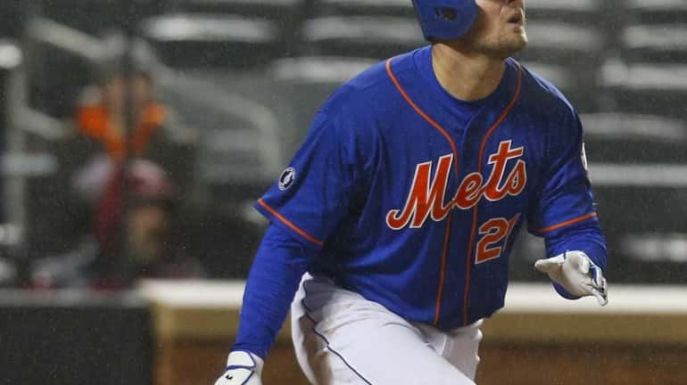 Lucas Duda of the Mets connects on a fourth inning...